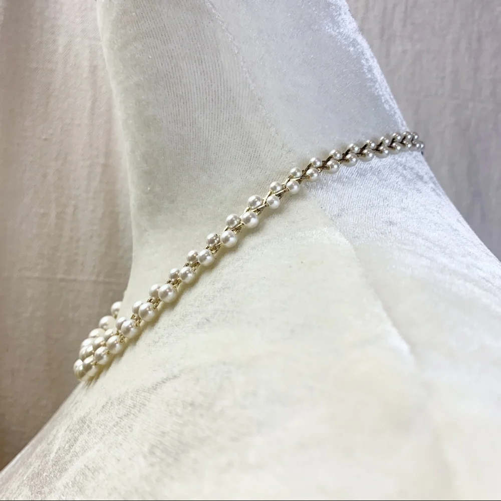 Gold Tone Chain Braided Faux White Pearl Necklace.